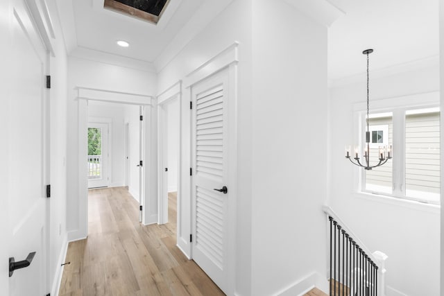 180 Rearden Way, Santa Rosa Beach, FL 32459 - hallway featuring a chandelier, light wood-type flooring, ornamental molding, baseboards, and recessed lighting