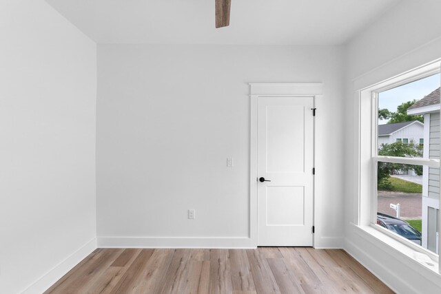 180 Rearden Way, Santa Rosa Beach, FL 32459 - spare room featuring light wood-type flooring, a ceiling fan, and baseboards