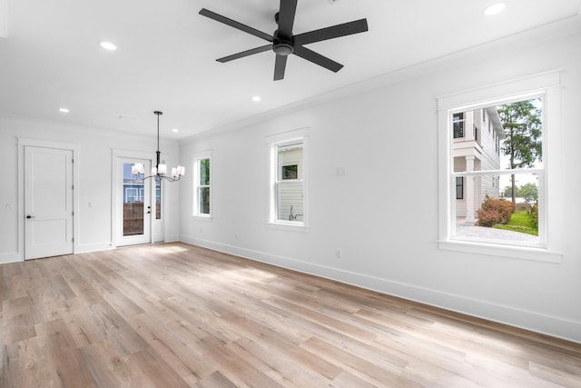 180 Rearden Way, Santa Rosa Beach, FL 32459 - unfurnished living room with a chandelier, healthy amount of natural light, recessed lighting, light wood-style floors, and baseboards