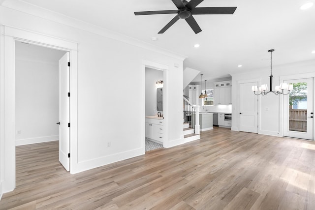 180 Rearden Way, Santa Rosa Beach, FL 32459 - unfurnished living room featuring light wood-type flooring, a ceiling fan, a chandelier, recessed lighting, and stairway