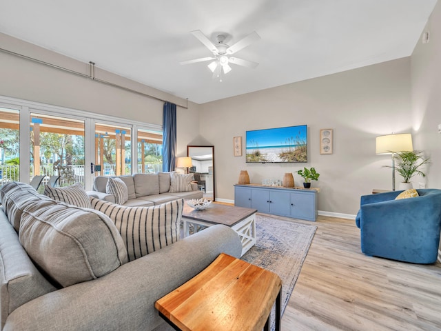 4205 Indian Bayou Trl Unit 10, Destin, FL 32541 - living area featuring baseboards, light wood-style flooring, and ceiling fan
