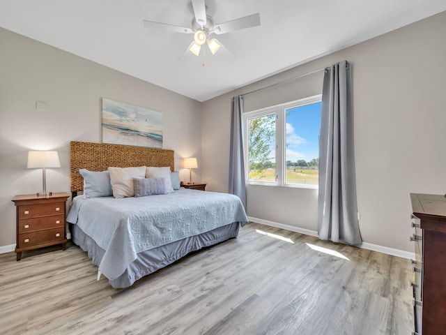 4205 Indian Bayou Trl Unit 10, Destin, FL 32541 - bedroom featuring light wood-style floors, baseboards, and ceiling fan