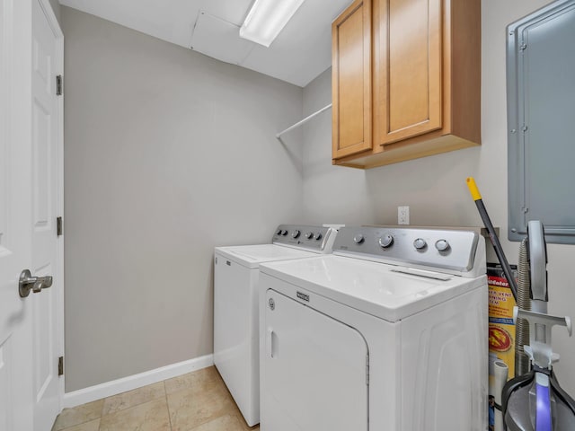 4205 Indian Bayou Trl Unit 10, Destin, FL 32541 - clothes washing area featuring cabinet space, washer and clothes dryer, and baseboards