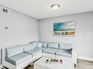 308 Miracle Strip Pkwy Unit 1C, Fort Walton Beach, FL 32548 - living area with wood finished floors and baseboards