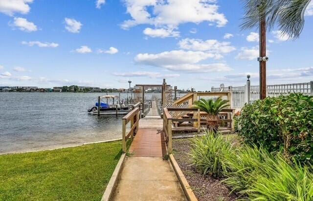 308 Miracle Strip Pkwy Unit 1C, Fort Walton Beach, FL 32548 - dock featuring a water view