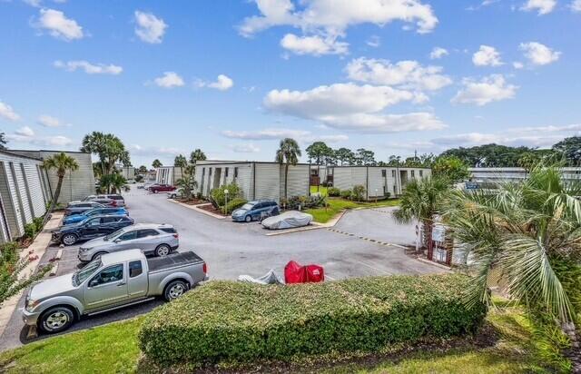 308 Miracle Strip Pkwy Unit 1C, Fort Walton Beach, FL 32548 - view of uncovered parking lot