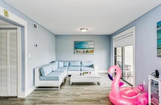 308 Miracle Strip Pkwy Unit 1C, Fort Walton Beach, FL 32548 - living area with wood finished floors and baseboards