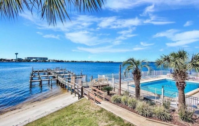 308 Miracle Strip Pkwy Unit 1C, Fort Walton Beach, FL 32548 - dock area with a water view, a community pool, and fence