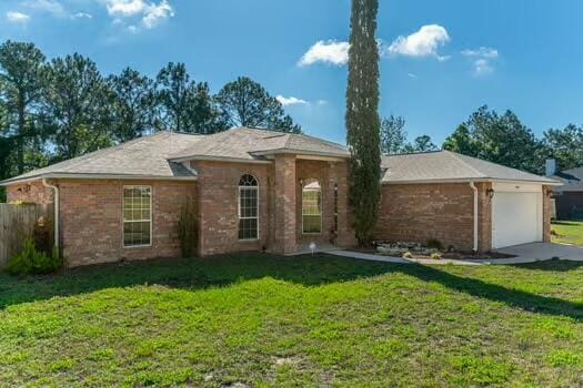 430 Hatchee Dr, Crestview, FL 32536 - ranch-style home featuring a garage and brick siding