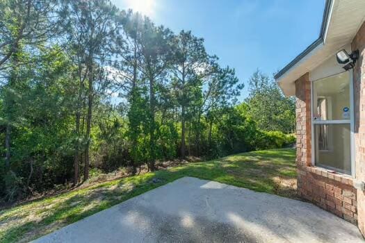 430 Hatchee Dr, Crestview, FL 32536 - view of grassy yard with a patio