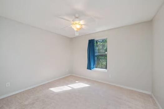 430 Hatchee Dr, Crestview, FL 32536 - carpeted spare room with baseboards and a ceiling fan