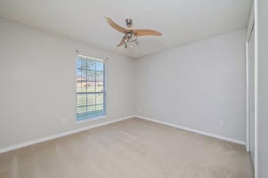 430 Hatchee Dr, Crestview, FL 32536 - carpeted spare room featuring ceiling fan and baseboards