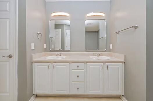 430 Hatchee Dr, Crestview, FL 32536 - full bathroom featuring double vanity and baseboards