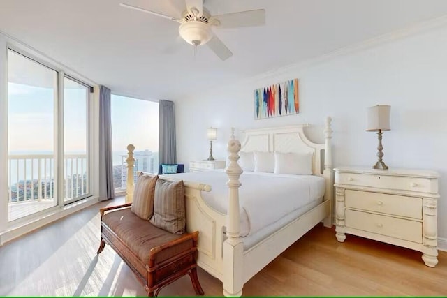 15100 Emerald Coast Pkwy Unit Ph4, Destin, FL 32541 - bedroom featuring wood finished floors and a ceiling fan