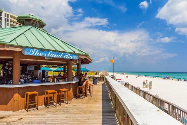 15100 Emerald Coast Pkwy Unit Ph4, Destin, FL 32541 - wooden terrace with view of water and beach