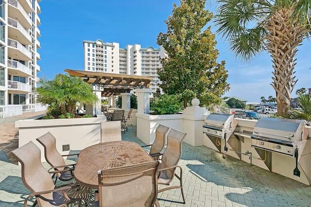 15100 Emerald Coast Pkwy Unit Ph4, Destin, FL 32541 - view of patio / terrace with outdoor dining area and a pergola