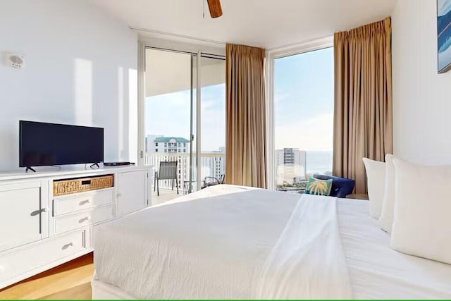 15100 Emerald Coast Pkwy Unit Ph4, Destin, FL 32541 - bedroom featuring floor to ceiling windows and access to exterior