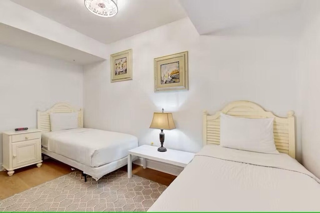15100 Emerald Coast Pkwy Unit Ph4, Destin, FL 32541 - bedroom with light wood finished floors