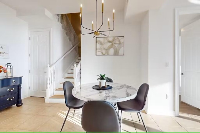 15100 Emerald Coast Pkwy Unit Ph4, Destin, FL 32541 - dining space featuring stairway, a chandelier, and light tile patterned floors