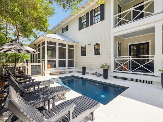 121 Red Cedar Way, Santa Rosa Beach, FL 32459 - swimming pool featuring a sunroom and a patio