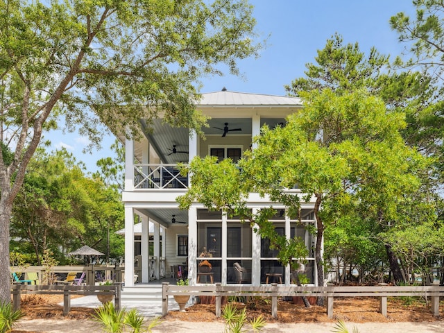 121 Red Cedar Way, Santa Rosa Beach, FL 32459 - back of house with a ceiling fan, a balcony, metal roof, and a sunroom