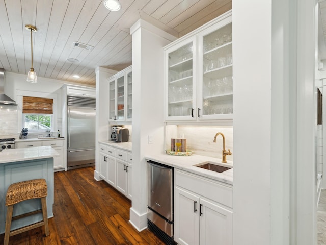 121 Red Cedar Way, Santa Rosa Beach, FL 32459 - kitchen with built in fridge, wooden ceiling, a sink, dark wood-style floors, and light stone countertops