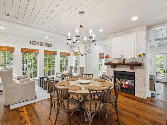 121 Red Cedar Way, Santa Rosa Beach, FL 32459 - dining space featuring dark wood-style flooring, wood ceiling, a multi sided fireplace, recessed lighting, and a chandelier