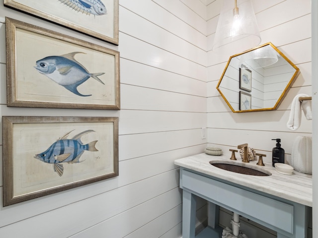121 Red Cedar Way, Santa Rosa Beach, FL 32459 - bathroom with a sink and wooden walls