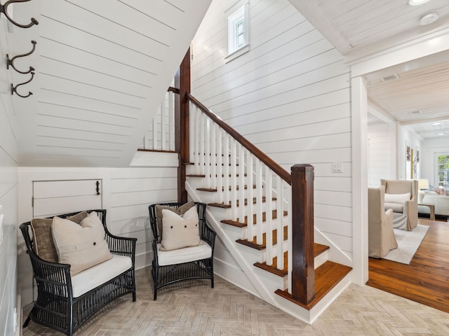 121 Red Cedar Way, Santa Rosa Beach, FL 32459 - stairway featuring wooden walls, vaulted ceiling, and wooden ceiling