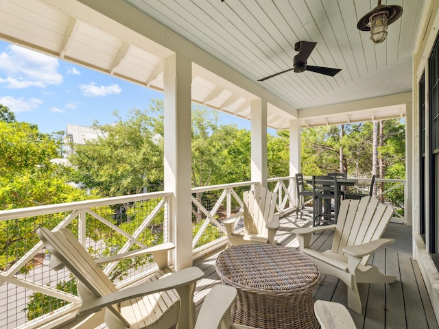 121 Red Cedar Way, Santa Rosa Beach, FL 32459 - wooden deck featuring a ceiling fan and view of wooded area