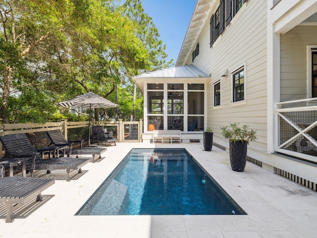 121 Red Cedar Way, Santa Rosa Beach, FL 32459 - swimming pool with a sunroom and a patio