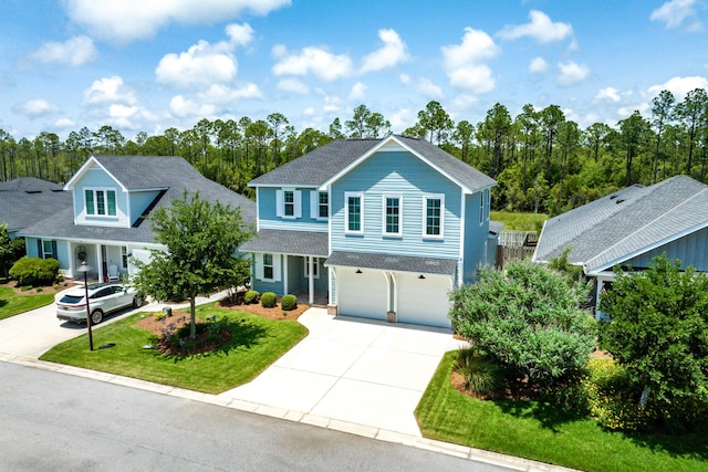 101 Windrow Way Lot 255, Watersound, FL 32461 - traditional-style house with driveway, an attached garage, a shingled roof, and a front yard