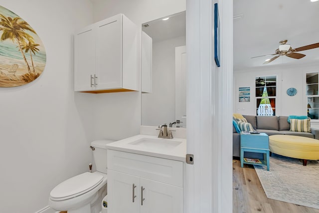 101 Windrow Way Lot 255, Watersound, FL 32461 - bathroom featuring connected bathroom, wood finished floors, vanity, a ceiling fan, and toilet