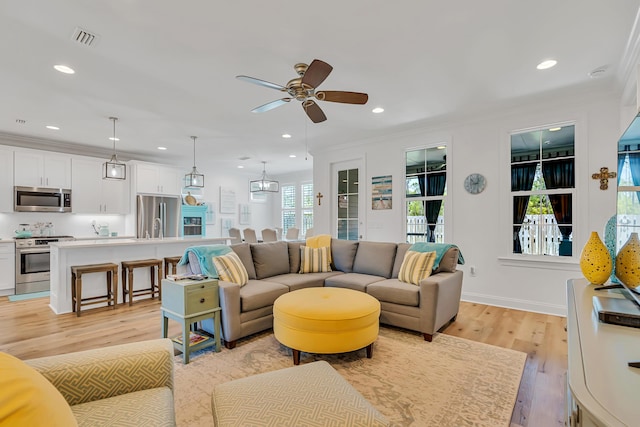101 Windrow Way Lot 255, Watersound, FL 32461 - living room featuring a ceiling fan, light wood-style flooring, ornamental molding, and recessed lighting