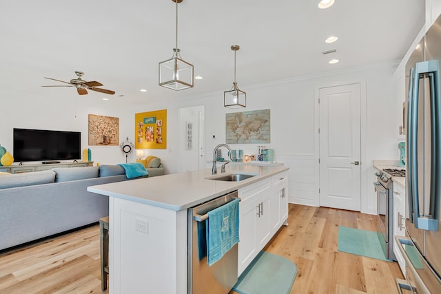 101 Windrow Way Lot 255, Watersound, FL 32461 - kitchen featuring appliances with stainless steel finishes, a sink, light countertops, white cabinetry, and crown molding