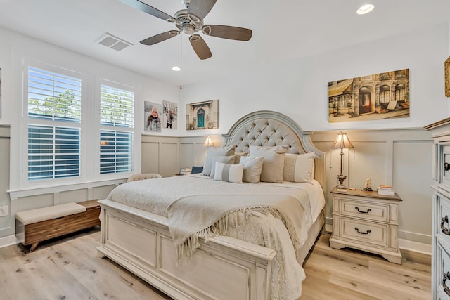101 Windrow Way Lot 255, Watersound, FL 32461 - bedroom featuring a decorative wall, light wood-style floors, ceiling fan, a wainscoted wall, and recessed lighting