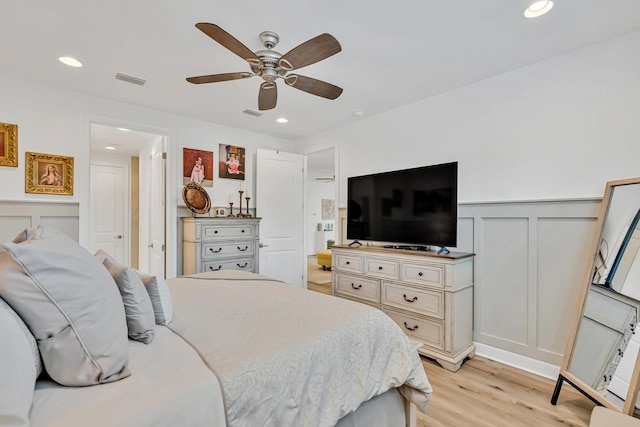 101 Windrow Way Lot 255, Watersound, FL 32461 - bedroom with a decorative wall, light wood-type flooring, wainscoting, recessed lighting, and ceiling fan