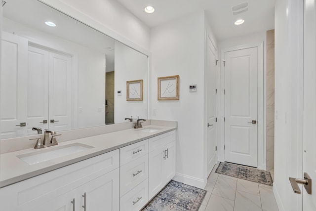 101 Windrow Way Lot 255, Watersound, FL 32461 - bathroom with double vanity, baseboards, marble finish flooring, recessed lighting, and a closet