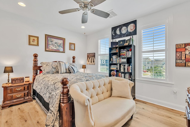 101 Windrow Way Lot 255, Watersound, FL 32461 - bedroom with multiple windows, light wood-style floors, baseboards, and recessed lighting