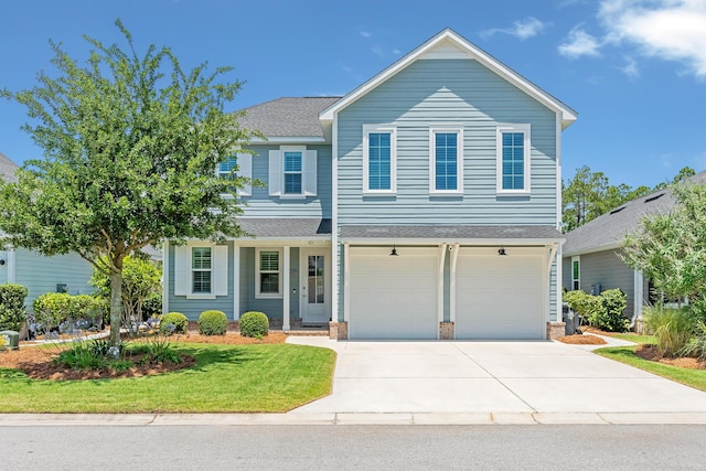 101 Windrow Way Lot 255, Watersound, FL 32461 - view of front of home featuring roof with shingles, driveway, a front lawn, and an attached garage