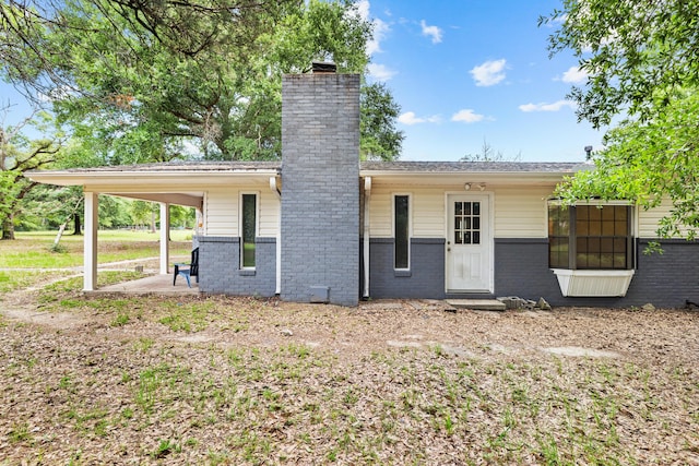 540 John King Rd, Crestview, FL 32539 - back of house with a chimney and brick siding