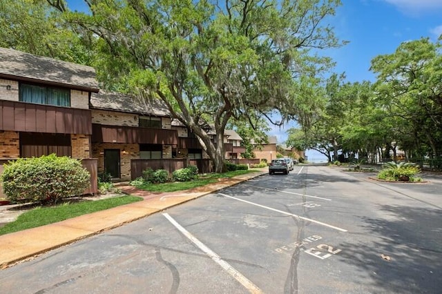 3871 Indian Trl Unit 2E, Destin, FL 32541 - view of asphalt street with curbs, sidewalks, and a residential view