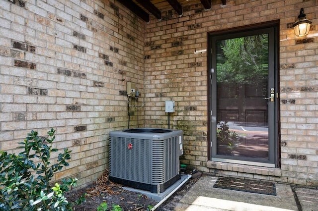 3871 Indian Trl Unit 2E, Destin, FL 32541 - entrance to property with central AC unit and brick siding