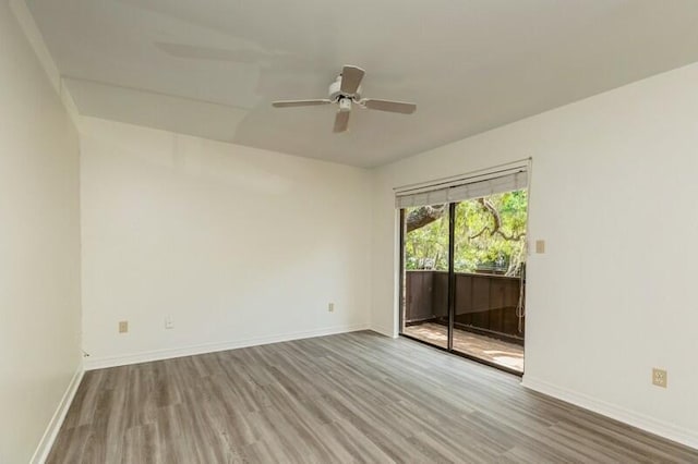 3871 Indian Trl Unit 2E, Destin, FL 32541 - unfurnished room with wood finished floors, ceiling fan, and baseboards
