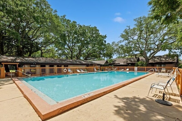 3871 Indian Trl Unit 2E, Destin, FL 32541 - community pool with a patio area and fence
