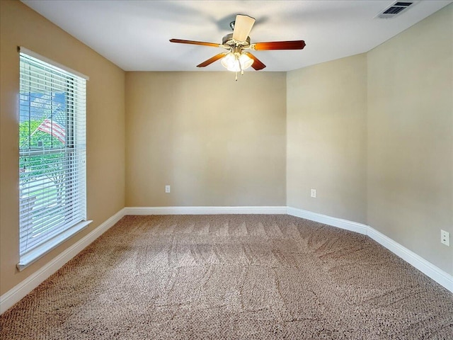 8296 Randall Dr, Navarre, FL 32566 - spare room with healthy amount of natural light, carpet flooring, a ceiling fan, and baseboards