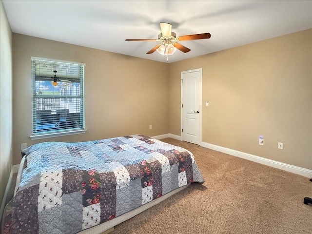 8296 Randall Dr, Navarre, FL 32566 - carpeted bedroom with baseboards and ceiling fan
