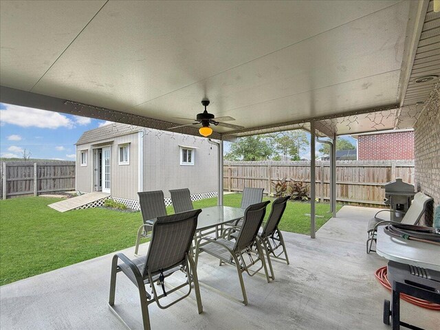8296 Randall Dr, Navarre, FL 32566 - view of patio / terrace featuring outdoor dining space, an outdoor structure, and ceiling fan
