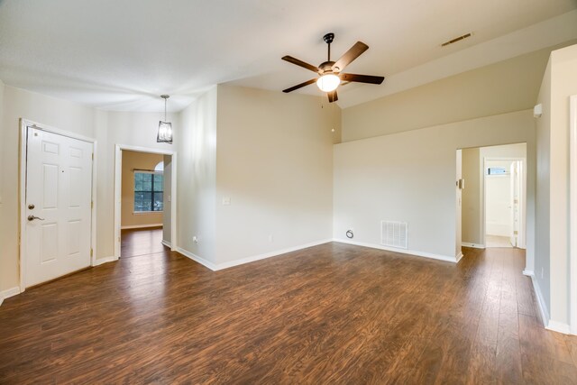 unfurnished room with a ceiling fan, dark wood-style floors, baseboards, and lofted ceiling