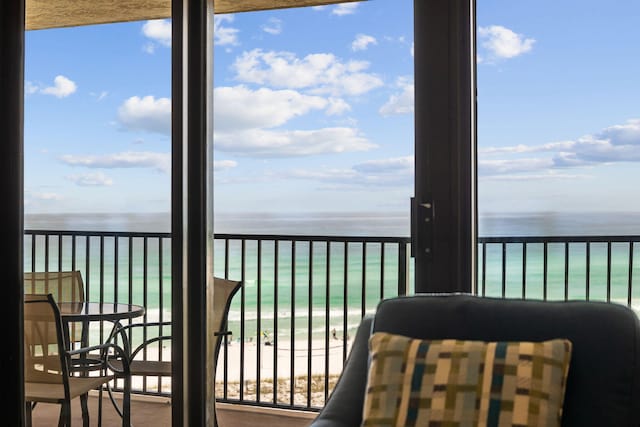 balcony featuring view of water and beach